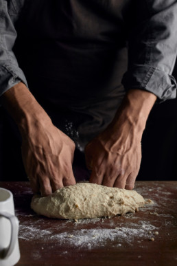 Kneading sourdough on the table