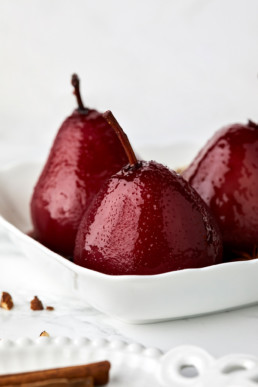 Pears poached in red wine with spices, topped with wine sauce