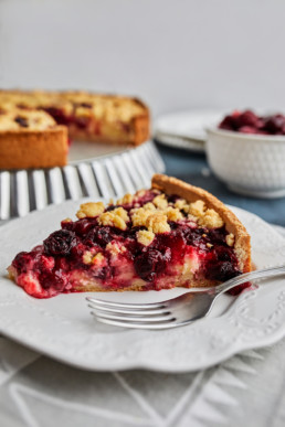 Piece of cherry crumble tart