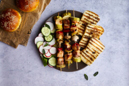 Chicken skewers with grilled haloumi cheese and fresh salad