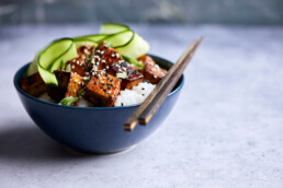 Stri fried tofu with rice and fresh cucumber