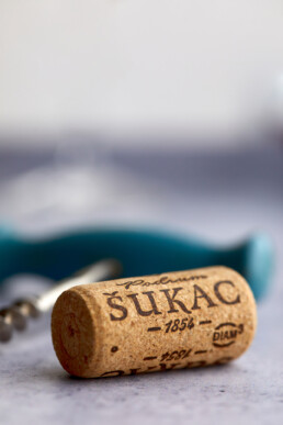 Wine cork with bottle opener